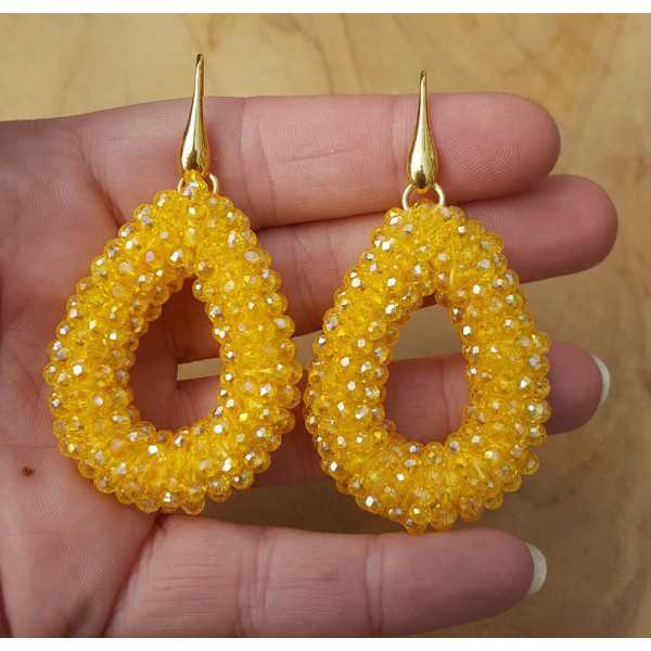 Gold plated earrings with open drop yellow crystals
