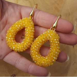 Gold plated earrings with open drop yellow crystals