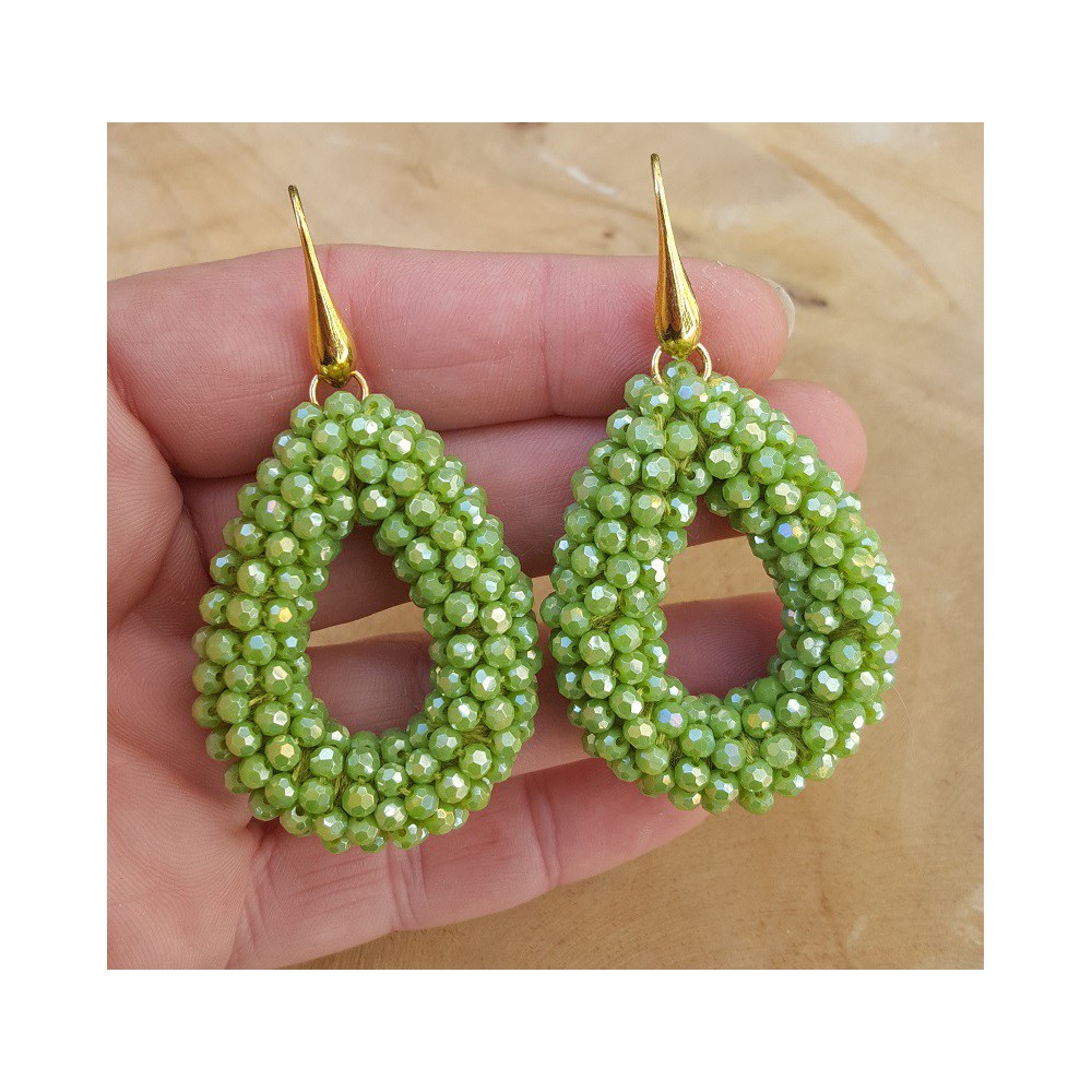 Gold plated earrings with open drop of green crystals