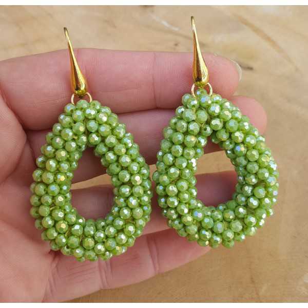 Vergoldete Ohrringe mit offenem Tropfen grüne Kristalle