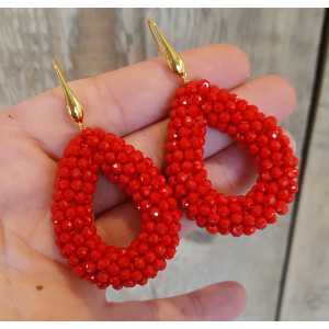 Gold plated earrings with open drop of red crystals