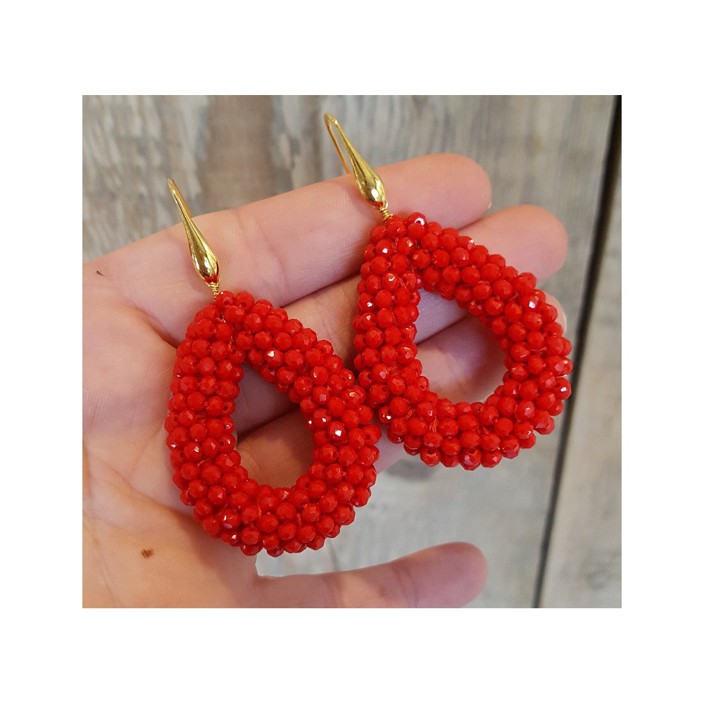 Gold plated earrings with open drop of red crystals