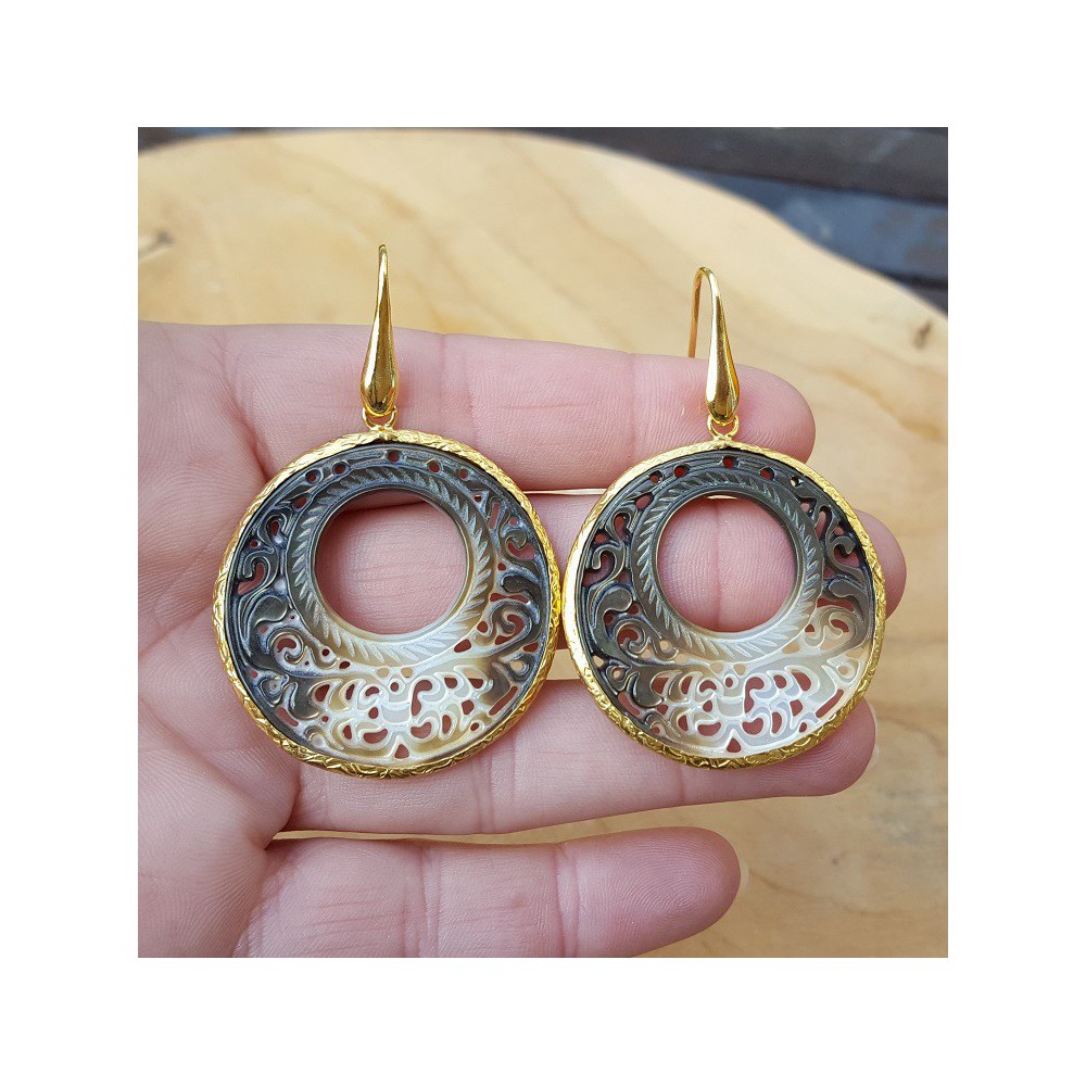 Gold plated earrings with round cut out shell