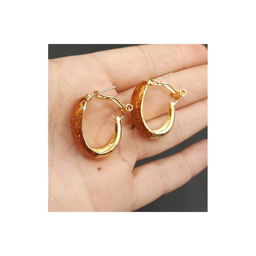 Gouden brede oranje glitter creolen