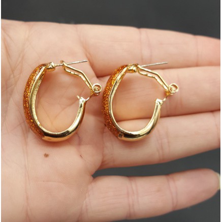 Gouden brede oranje glitter creolen