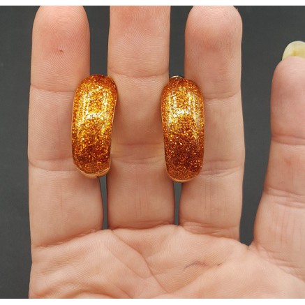 Gouden brede oranje glitter creolen