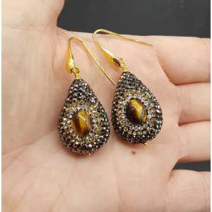 Earrings set with tiger's eye and black crystals