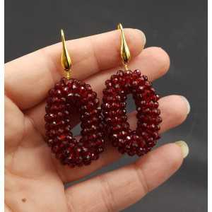 Gold plated earrings small oval pendant of Garnet red crystals