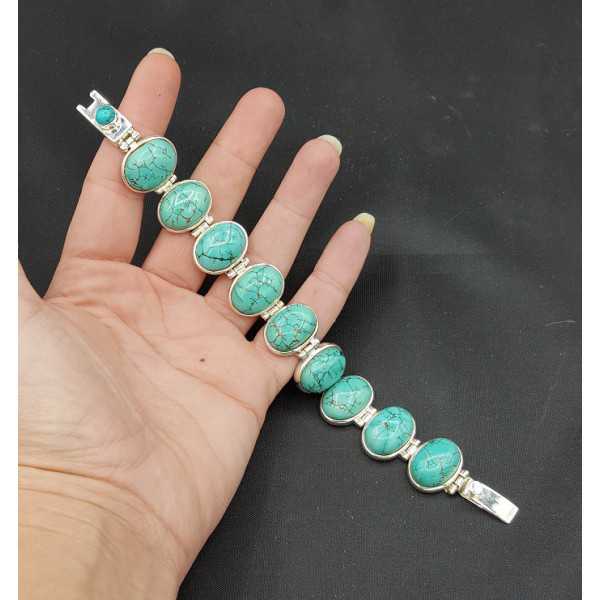 Silver bracelet with oval cabochon cut Turquoise links
