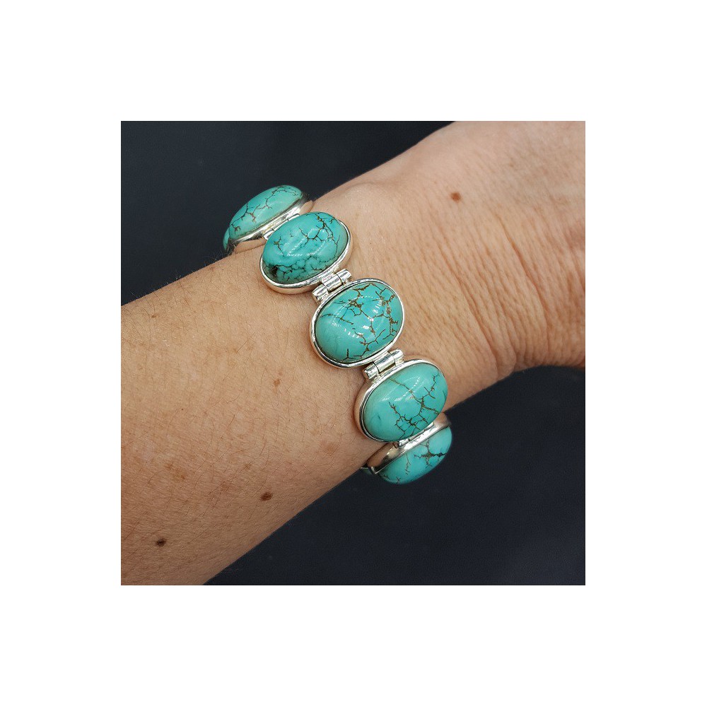 Silver bracelet with oval cabochon cut Turquoise links