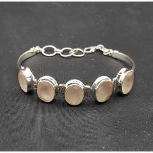 Silver bracelet set with five oval facet rose quartz stones
