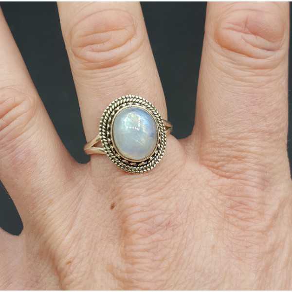 Silver ring set with cabochon oval rainbow Moonstone