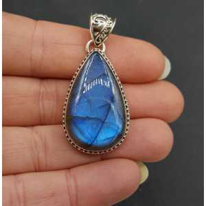 Silver pendant teardrop shaped Labradorite set in a carved setting