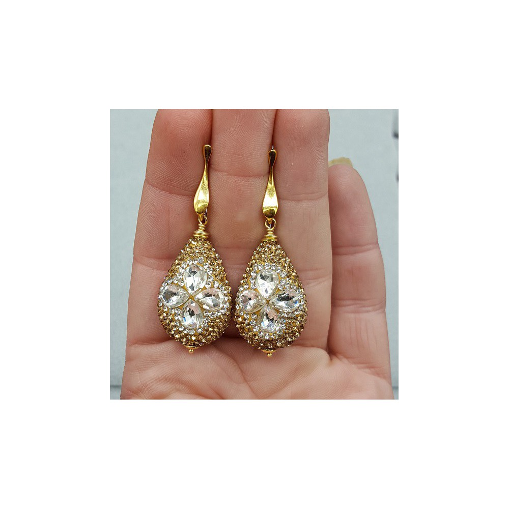 Gold plated earrings with drop, set with white and gold crystals