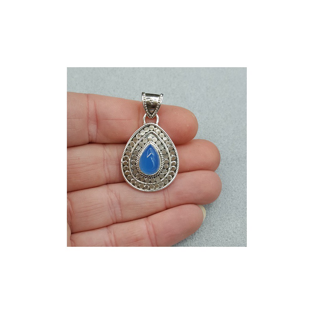 Silver pendant set with teardrop shaped blue Chalcedony