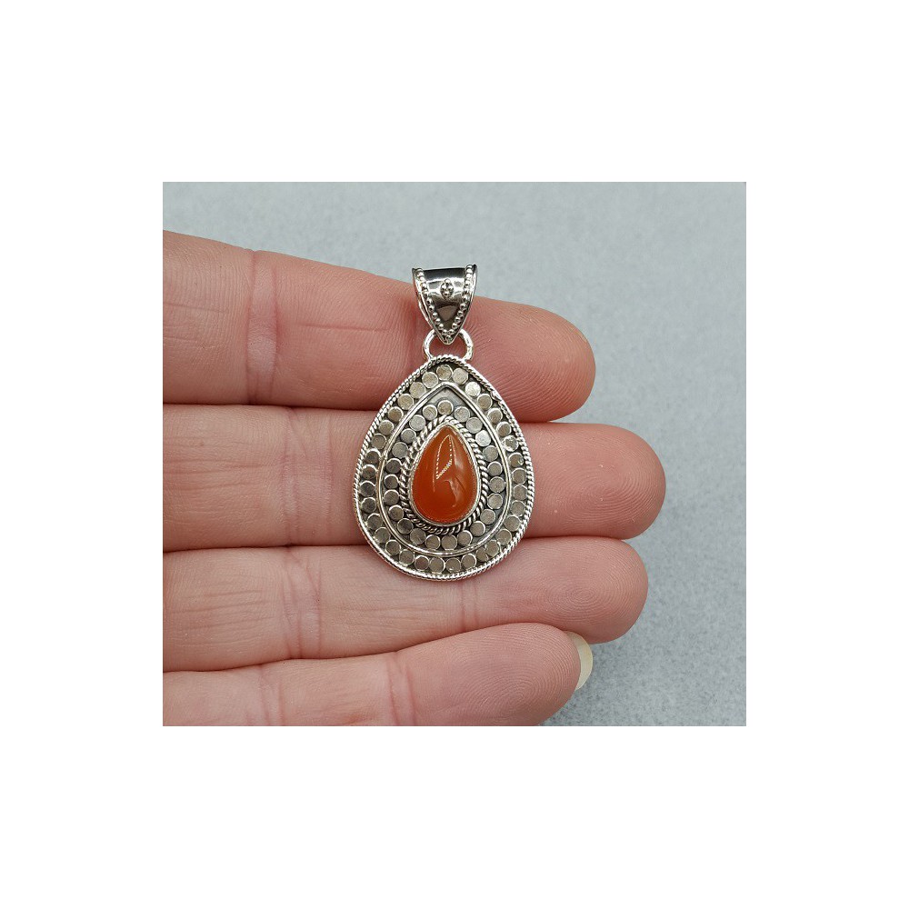 Silver pendant set with teardrop shaped Carnelian