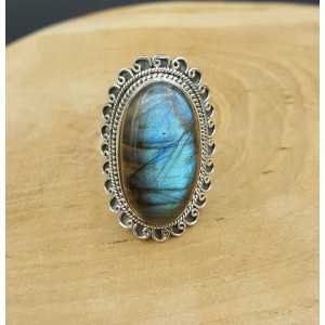 Silver ring with oval Labradorite and carved head 18 mm