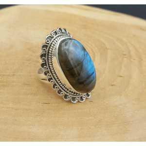 Silver ring with oval Labradorite and carved head 18 mm