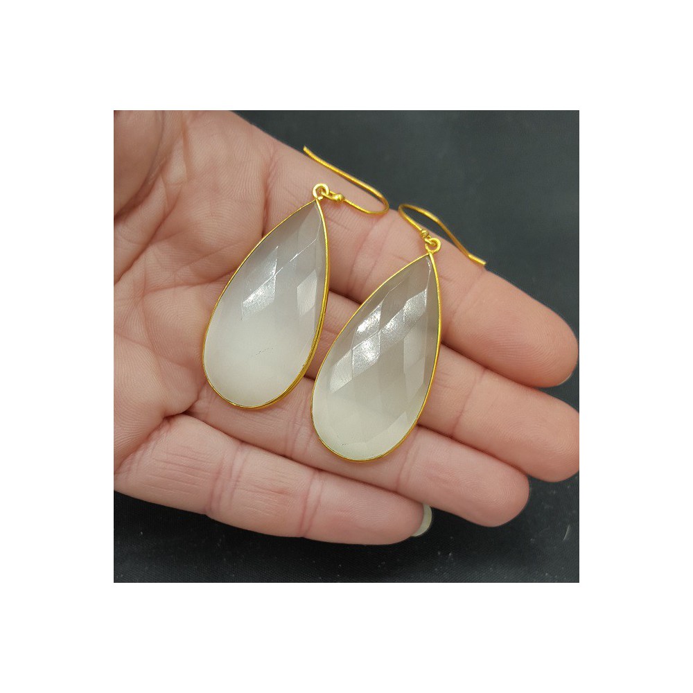 Gold plated earrings with large narrow white cat's eye