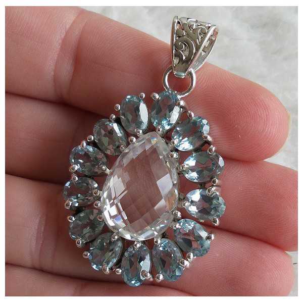 Silver pendant set with faceted blue Topaz and white Topaz 