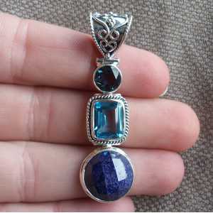 Silver pendant set with round Sapphires and blue Topazes 