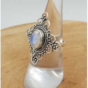 Silver ring set with faceted Moonstone and carved head