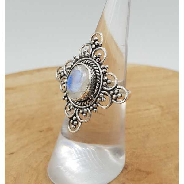 Silver ring set with faceted Moonstone and carved head