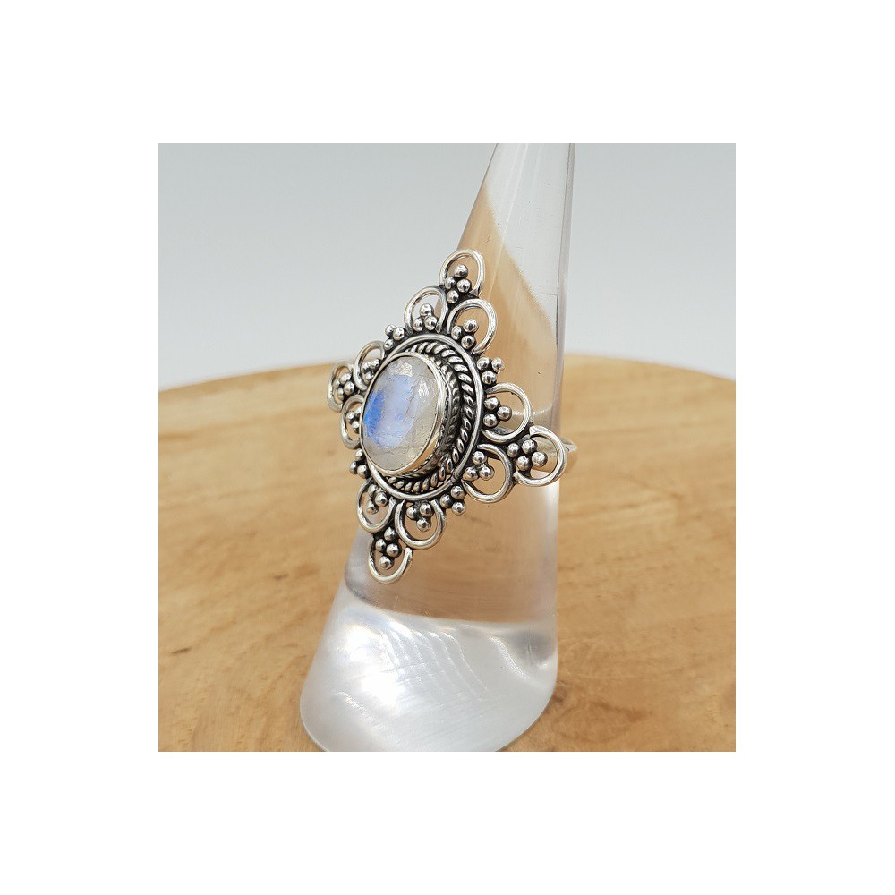 Silver ring set with faceted Moonstone and carved head