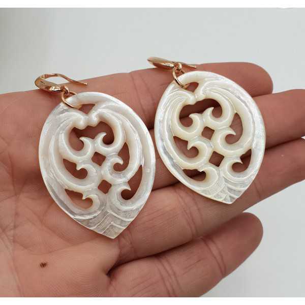 Earrings with carved mother-of-Pearl