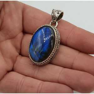 Silver pendant oval Labradorite set in a carved setting
