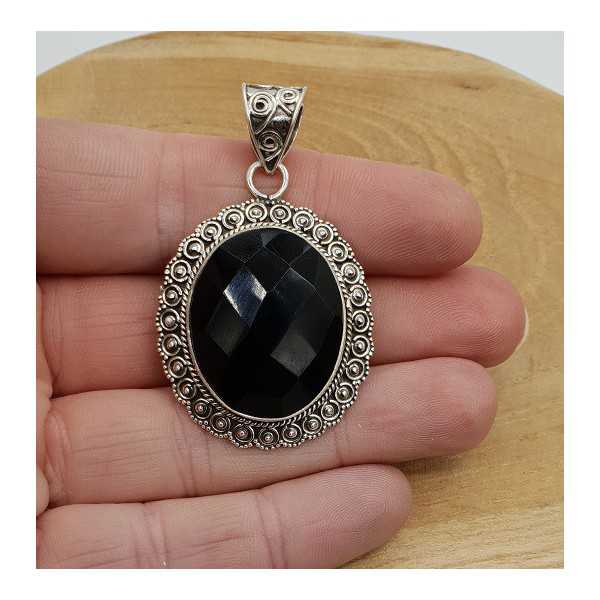 Silver pendant with oval facet black Onyx in the edited setting