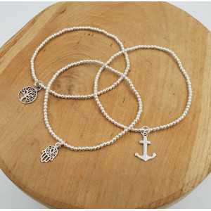 Silver bracelet with silver beads and charm