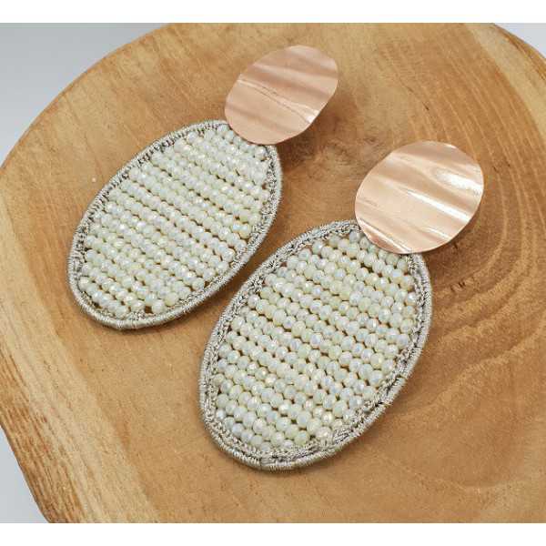 Rose gold plated earrings with oval pendant made of silk thread and crystals