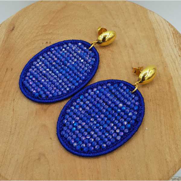 Gold plated earrings with oval pendant made of silk thread and crystals