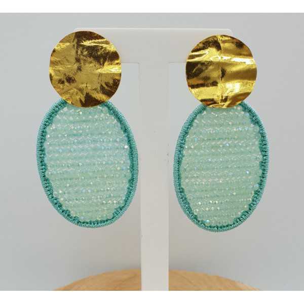 Gold plated earrings with oval pendant made of silk thread and crystals