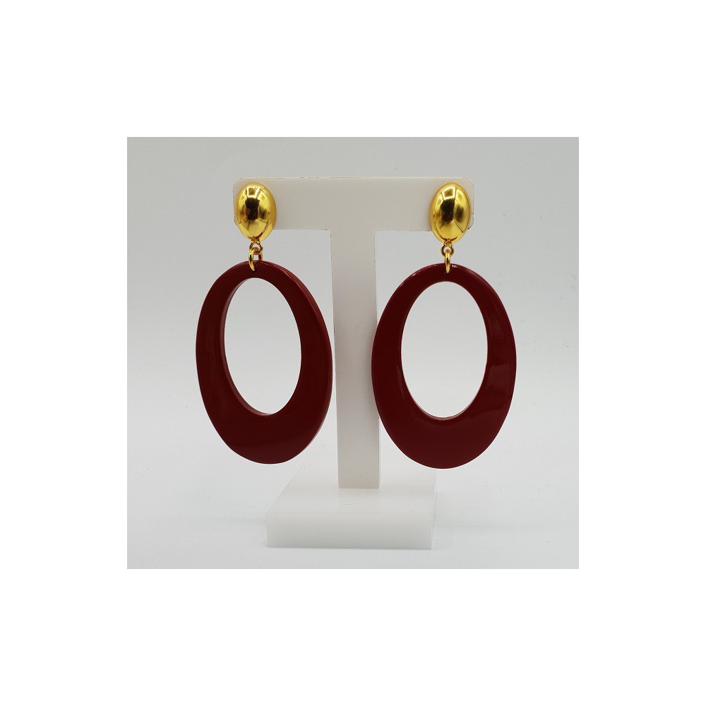 Earrings with oval red buffalo horn pendant