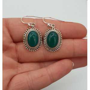 Silver earrings with oval cabochon cut green Onyx