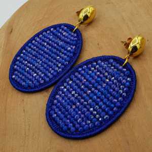 Earrings with oval pendant made of silk thread and blue crystals