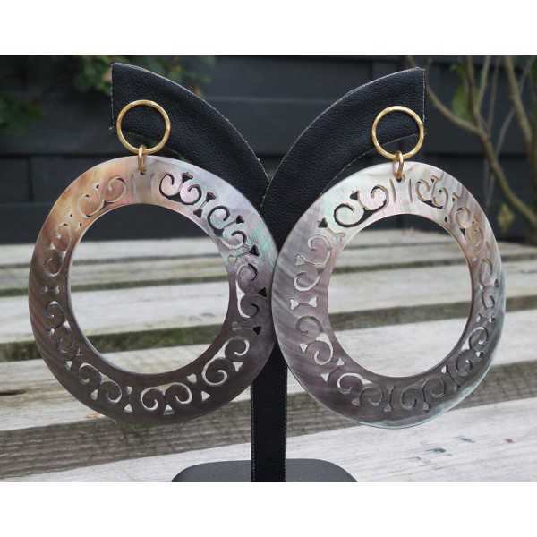 Gold plated earrings with large carved blacklip shell rings 