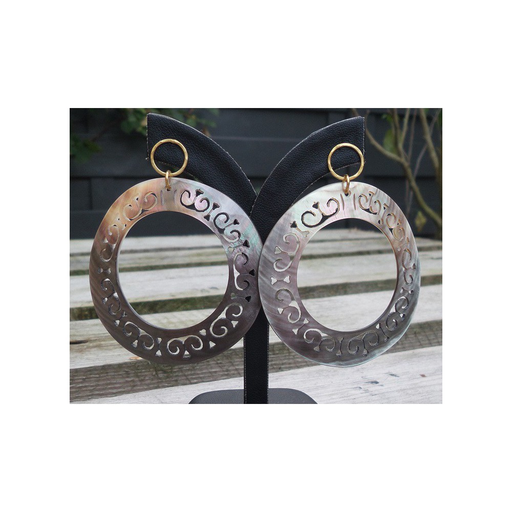 Gold plated earrings with large carved blacklip shell rings 