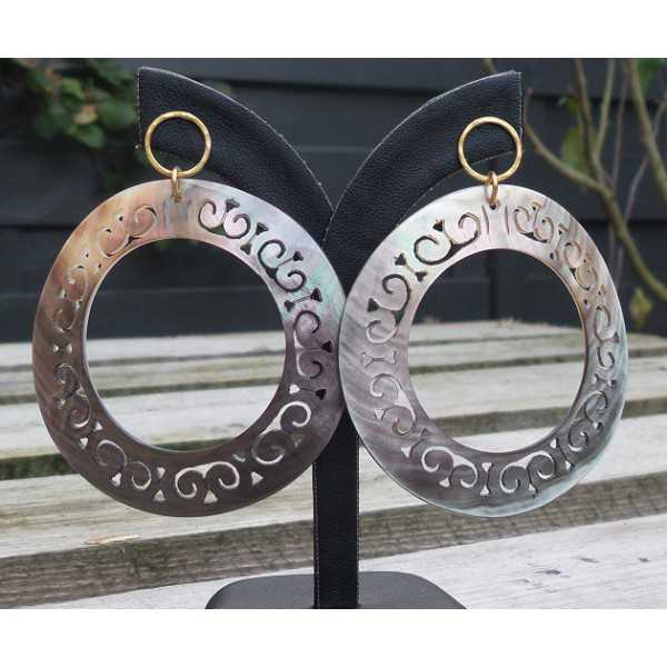 Gold plated earrings with large carved blacklip shell rings 