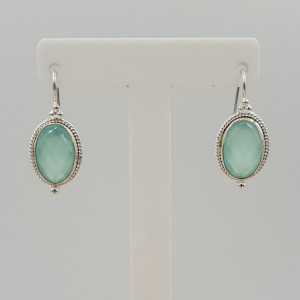 Silver earrings set with oval faceted aqua Chalcedony