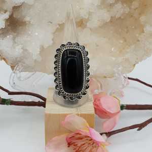 Silver ring with rectangular black Onyx and carved head 18.5 mm