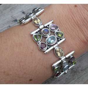 Silver bracelet set with facet cut multi gemstones