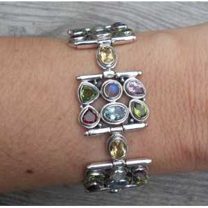 Silver bracelet set with facet cut multi gemstones