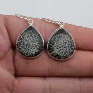 Silver earrings set with black Coral
