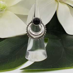 Silver half-moon ring set with round black Onyx