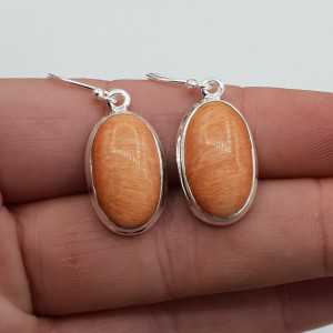 Silver earrings set with oval Celestobariet