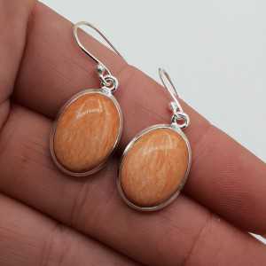 Silver earrings set with large oval Celestobariet