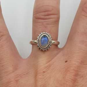 Silver ring set with small oval Moonstone